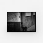 A wall art print of a man sitting down in Bolivia