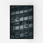A dark apartment building with a man standing at the window in Buenos Aires.