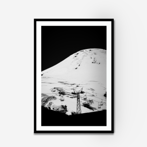 a black and white photograph of a ski lift up a volcano in chile