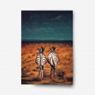Two black and white zebras stanading in an orange field surounded by a dark stormy sky.