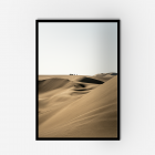 A framed photograph of sand dunes in peru