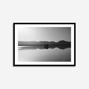 Black and white mountain range reflection photograph print with a car in Bolivia.