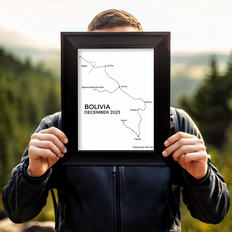 man holding up a line art of backpacking route