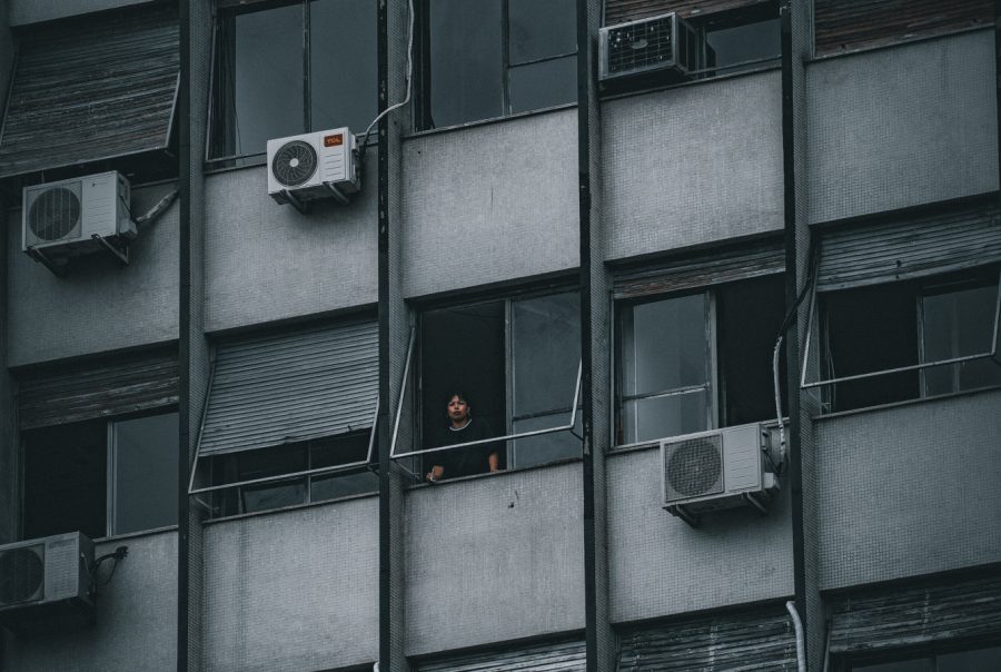 Blue and black photograph of a Buenos Aires apartment building