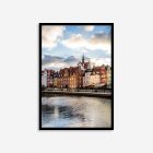 Colorful historic buildings lining the Motława River in Gdańsk, Poland, showcasing charming architecture and vibrant waterfront views.