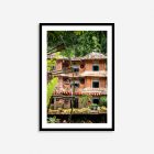 Colorful Cat Cat Village wall art with traditional bamboo water wheels in lush Vietnamese highlands.