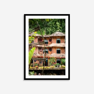 Colorful Cat Cat Village wall art with traditional bamboo water wheels in lush Vietnamese highlands.