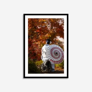 a japanese woman in traditional dress in autumn